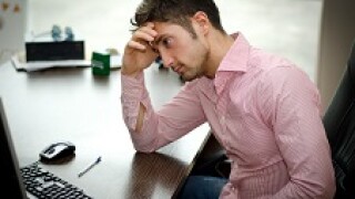 stressed man at computer