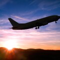 Airplane Taking Off into a Sunset.
