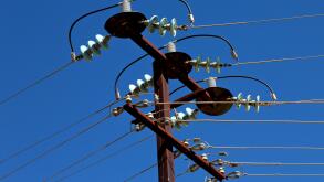 in  australia the concept of power line with electrical pole in the clear sky