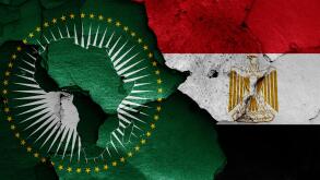 flags of Africa Union and Egypt painted on cracked wall