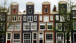 Typical Dutch houses along the canal in Amsterdam The Netherlands