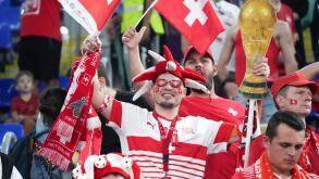 Doha, Qatar. 2nd Dec, 2022. Fans of Switzerland cheer for the team before the Group G match between Serbia and Switzerland at the 2022 FIFA World Cup at Stadium 974 in Doha, Qatar, Dec. 2, 2022. Credit: Li Gang/Xinhua/Alamy Live News
