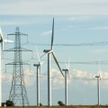 National Grid electricity transmission lines and pylons next to Nordex wind turbines at Little Cheyne Court wind farm Rye Sussex. Image shot 10/2010. Exact date unknown.