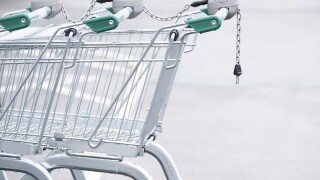 Trolley with coin operated lock chain in supermarket car park