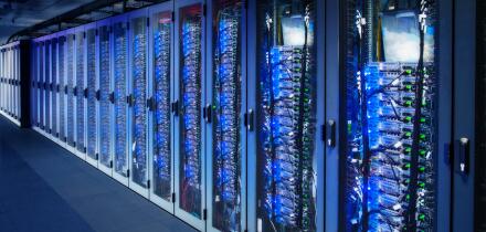 Network cabinets with server racks in a data center. Digital Composite (DC)
