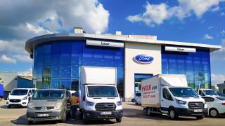 Izmir, Turkey - September 22, 2022: Ford logos on the dealership of the area, against blue sky.
