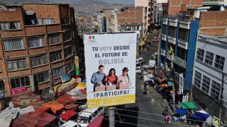 A Tribunal Electoral billboard with a message that reads in Spanish; "Your vote decides the future of Bolivia, participate" towers over a street in La Paz, Bolivia, Friday, Aug. 15, 2025, ahead of the country's upcoming general election. (AP Photo/Victor