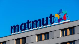 Sign with the logo of the French insurance company Matmut on the roof of a building in Paris, France