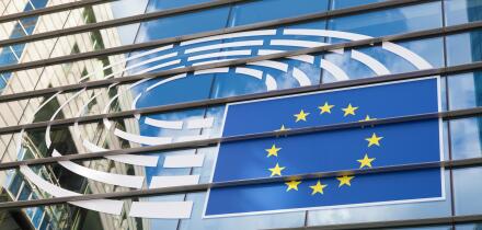 Logo of the European Parliament at the facade of European Parliament building in Leopold Square. August 21, 2015 in Brussels, Be