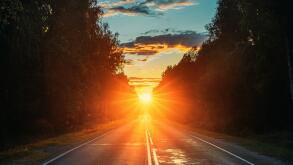 Sun Rising Over Asphalt Country Open Road In Sunny Morning Or Evening. Open Free Road In Summer Or Autumn Season At Sunny Sunset Or Sunrise Time