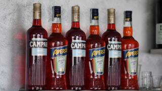 Cremona, Italy July 19th 2025 Several bottles of Campari and Aperol, two famous italian aperitifs, are standing on a bar shelf, ready to be served