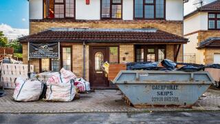 Construction site renovating a suburban house in Cardiff, Wales. Building industry. Building site. Home improvement. Home renovation. UK.