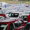 Buyers inspecting cars at a UK car auction