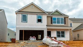 Horizontal shot of New Home Construction.  All visible markings and signs have been removed.