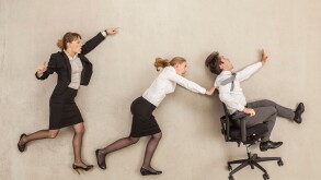 Business people chasing in office