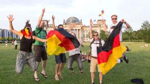 Football fans celebrate the German national football team's entry into the semi-finals at the Reichstag in Berlin, 04.07.2014, Berlin, Germany