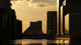 Canary Wharf office buildings at sunset in London UK. Image shot 2014. Exact date unknown.