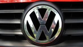 VW Logo on a red Volkswagen car