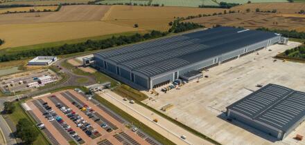 Aerial view of the Tritax Symmetry development at Symmetry Park, Biggleswade for the new portal framed regional distribution centre of the Co-op food group.
This steel-framed building covers 661,000 sq ft, 357 metres long, 144 metres wide, there are is al