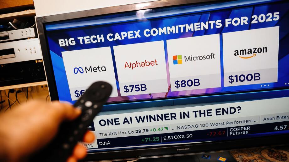 Paris, France - Feb 19, 2025: A person holds a remote while watching CNBC on a Panasonic TV, displaying Meta, Alphabet, Microsoft, and Amazon 2025 cap