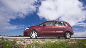 minivan on a background of cloudy sky.