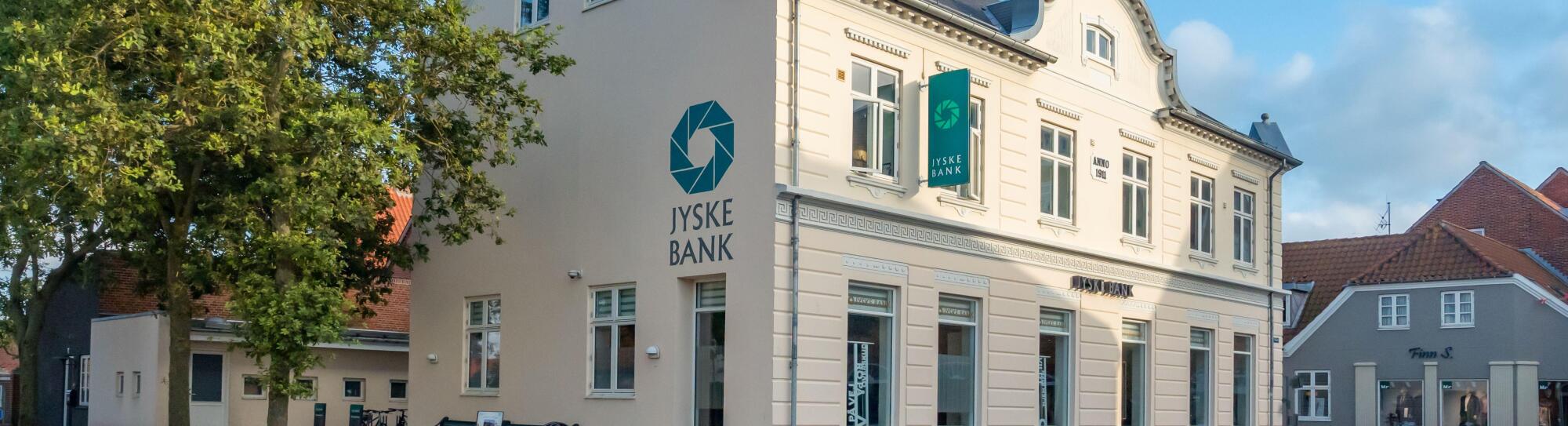 Jyske Bank Facade in Ringkobing Skjern on a sunny summer afternoon