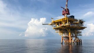 Oil and gas wellhead remote platform produced raw gas and oil then sent to central processing platform to separate water,gas and condensate (gas). adobe