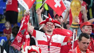 Doha, Qatar. 2nd Dec, 2022. Fans of Switzerland cheer for the team before the Group G match between Serbia and Switzerland at the 2022 FIFA World Cup at Stadium 974 in Doha, Qatar, Dec. 2, 2022. Credit: Li Gang/Xinhua/Alamy Live News