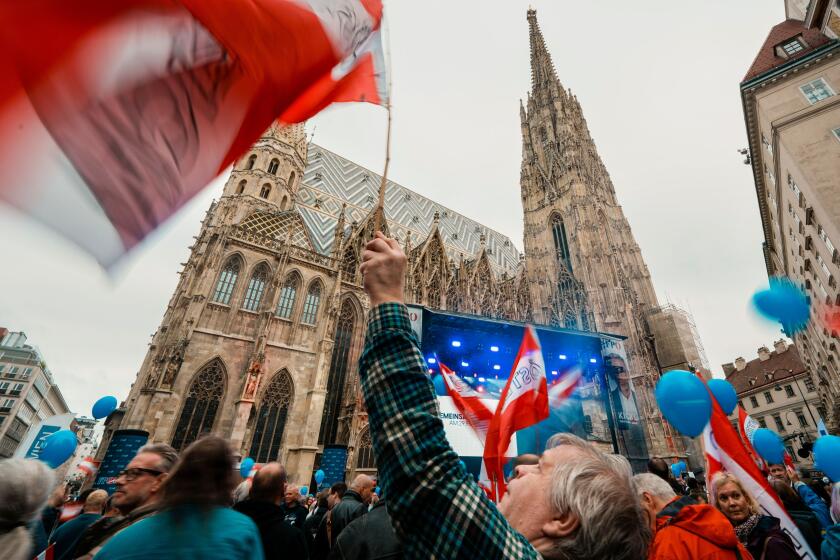 People attend the final electoral rally of Herbert Kickl, leader of the Freedom Party of Austria, outside the St. Stephen Cathedral, in Vienna, Austria, Friday, Sept. 27, 2024, ahead of the country's national election which will take place on Sept. 29. (A