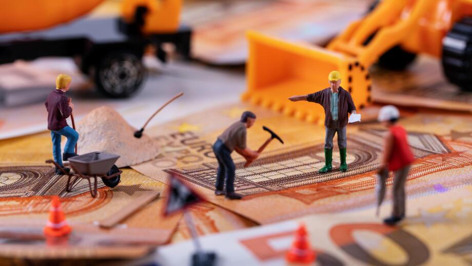 construction business concept - workers team working hard to earn more money