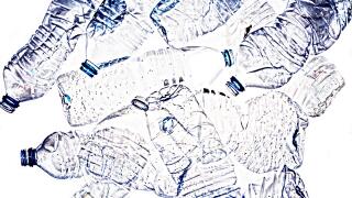 Isolated plastic bottles. Recycle, reuse and reduce concept. PVC, PET. Bright background