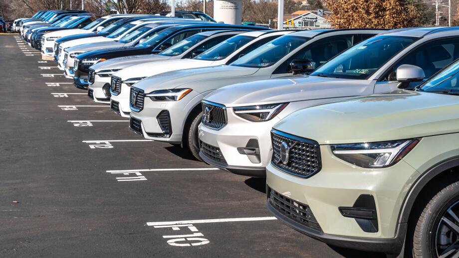 New Volvo vehicles lined up for sale at a dealership