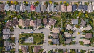 Aerial top down view of houses and streets in beautiful residential neighbourhood during fall season in Calgary, Alberta, Canada.