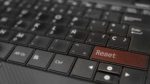 Reset concept. Reset key embedded in a computer keyboard