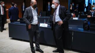 German Finance Minister Olaf Scholz talks to Managing Director of EMS (European Stability Mechanism) Klaus Regling, during a meeting of Eurogroup Finance Ministers at the European Council building in Luxembourg, Luxembourg June 17, 2021. Francisco Seco/Po