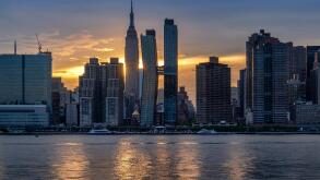 The Manhattan Skyline and Empire State Building across the East River at sunset, Manhattan, New York, USA
