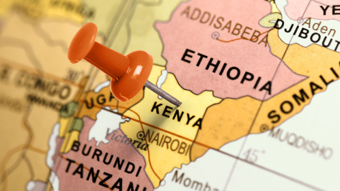 A red pint points out Kenya on a map