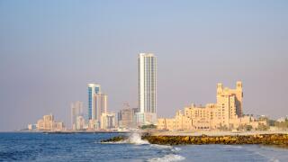 View of skyline along corniche waterfront of  Ajman emirate in United Arab Emirates