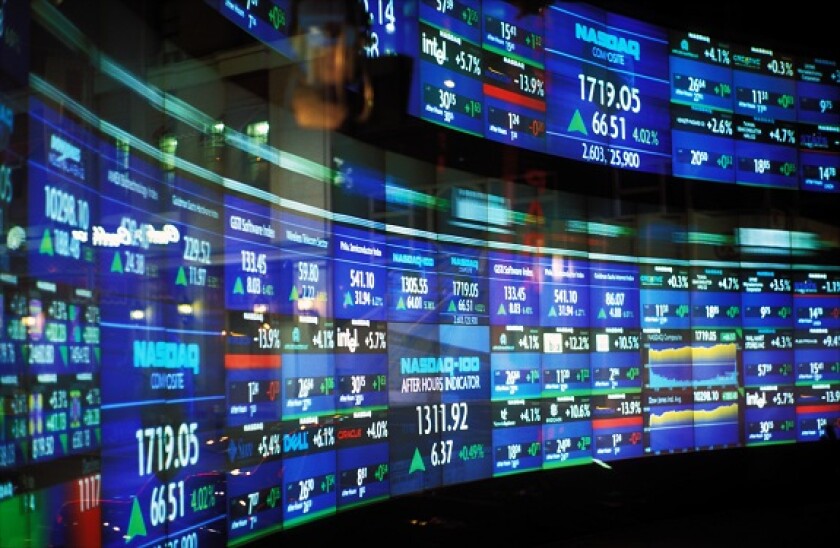 USA, New York, New York City, Nasdaq monitors with stock quotations
