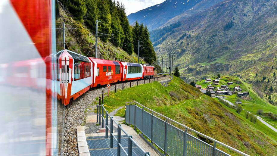 Zermatt 24,5,2023: Glacier Express red swiss train in Swiss Alps.Zermatt to St.Moritz. Switzerland in summer