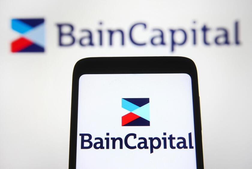 Ukraine. 05th Nov, 2021. In this photo illustration, Bain Capital, LP logo is seen displayed on a smartphone and a pc screen. Credit: SOPA Images Limited/Alamy Live News