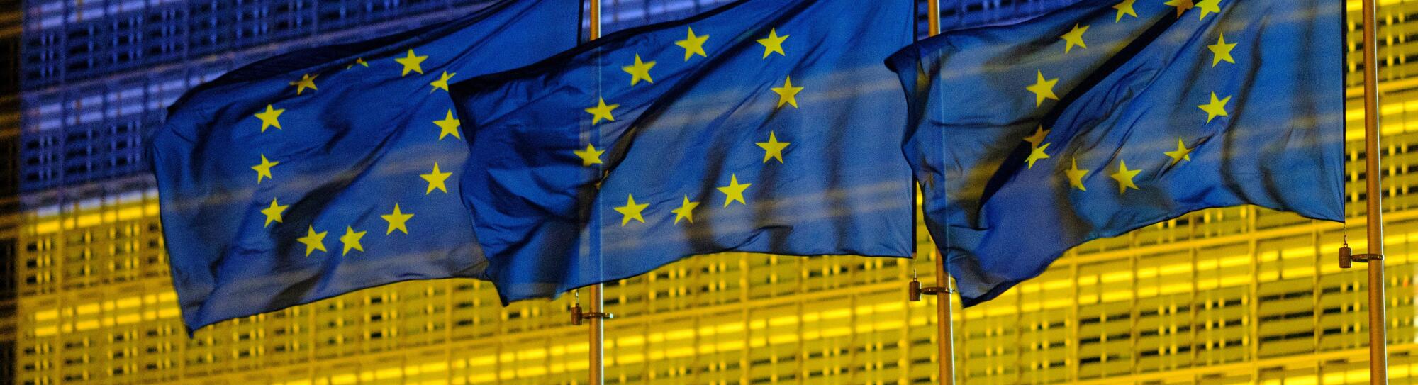 Belgium, Brussels, May 2022: facade of the Berlaymont building , headquarters of the European Commission, lit up in the colours of the Ukrainian flag.