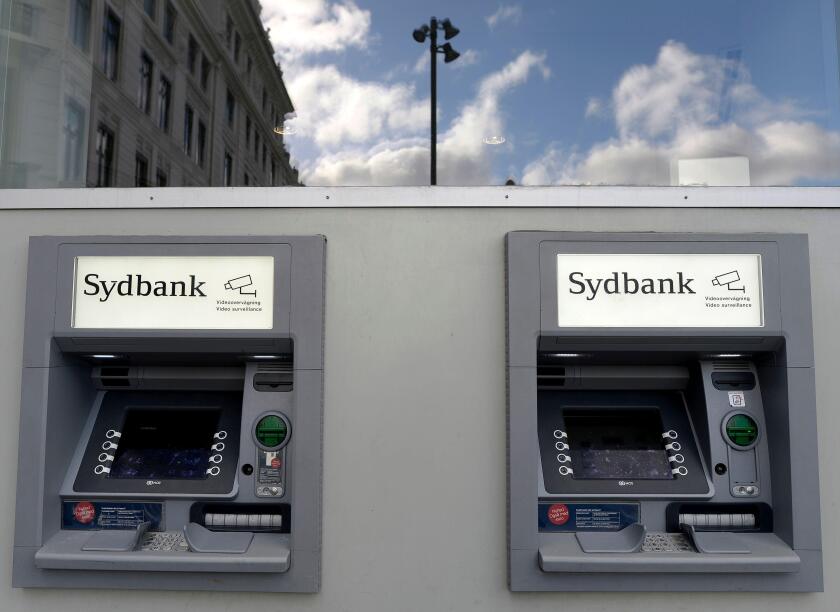 Cash machines of Danish finance institute Sydbank are pictured in Copenhagen, November 5, 2013. REUTERS/Fabian Bimmer (DENMARK - Tags: BUSINESS)