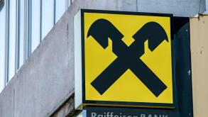 Bucharest/Romania - 10.18.2020: Raiffeisen bank logo at the entrance of a branch in Bucharest