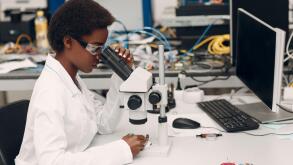 Scientist african american woman working in laboratory with electronic instruments