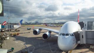 A Qantas Airbus A380-800 passenger aircraft parks at the gate at Kingsford Smith International Airport