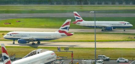 London, England, UK - 4 May 2024: Passenger planes operated by British Airways arriving and departing at London Heathrow airport.