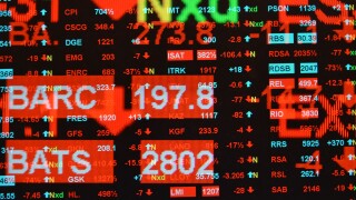 Multiple exposure of FTSE 100 main constituents screen for trading stocks and shares showing down day decreasing prices
