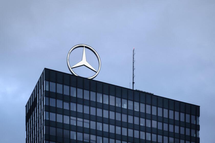 Mercedes-Benz rotating logo over the rooftop of the headquarter in Breitscheidplatz, Berlin, Germany