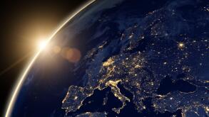 Planet Earth at night, view of city lights showing human activity in Europe and Middle East from space. World map on dark globe at sunrise on satellit